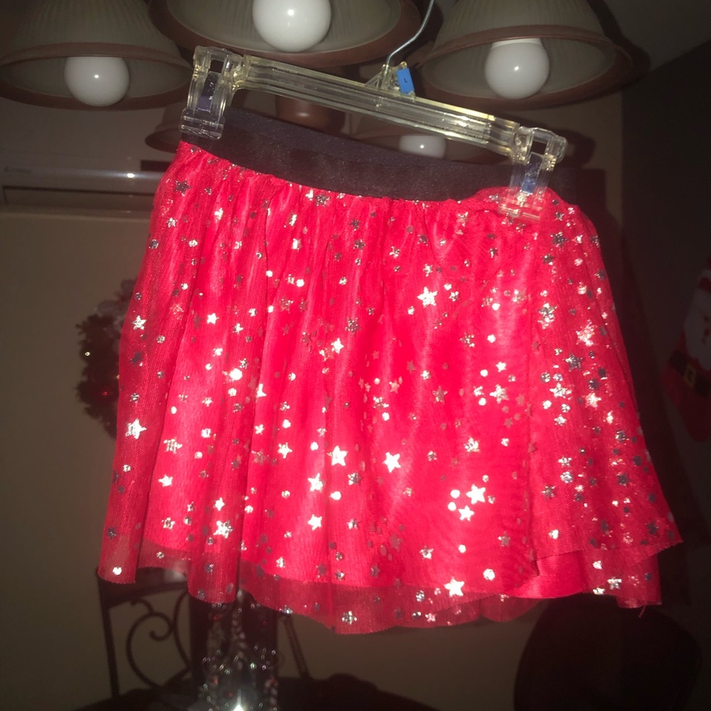 Girls skirt, worn once. Red with silver stars. Size 6/6X